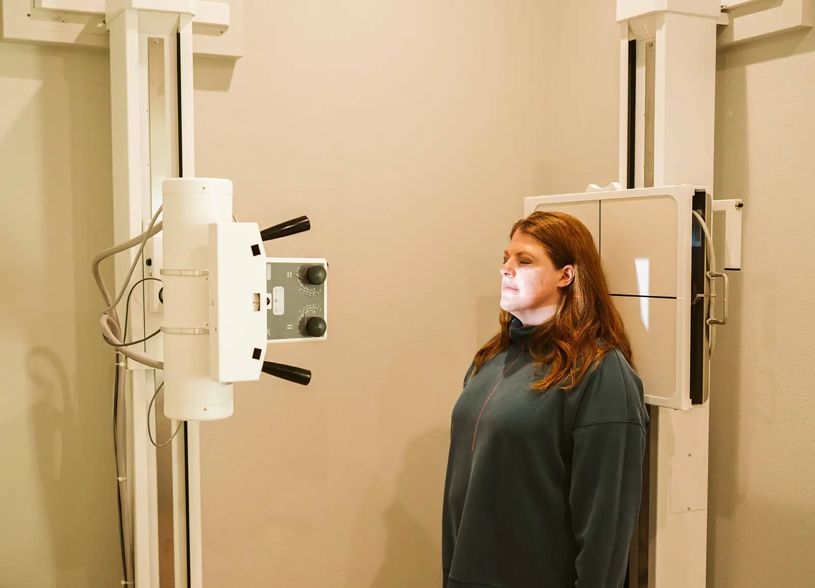 A patient positioned for digital X-ray imaging at Summit Spine & Wellness