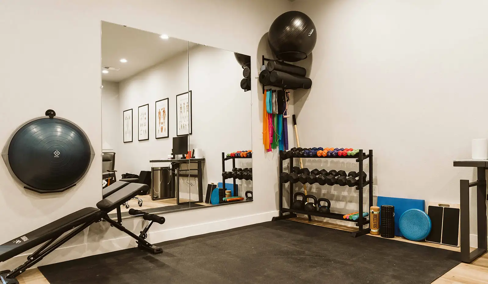 Exercise space at Summit Spine & Wellness with resistance bands, weights, and balance equipment
